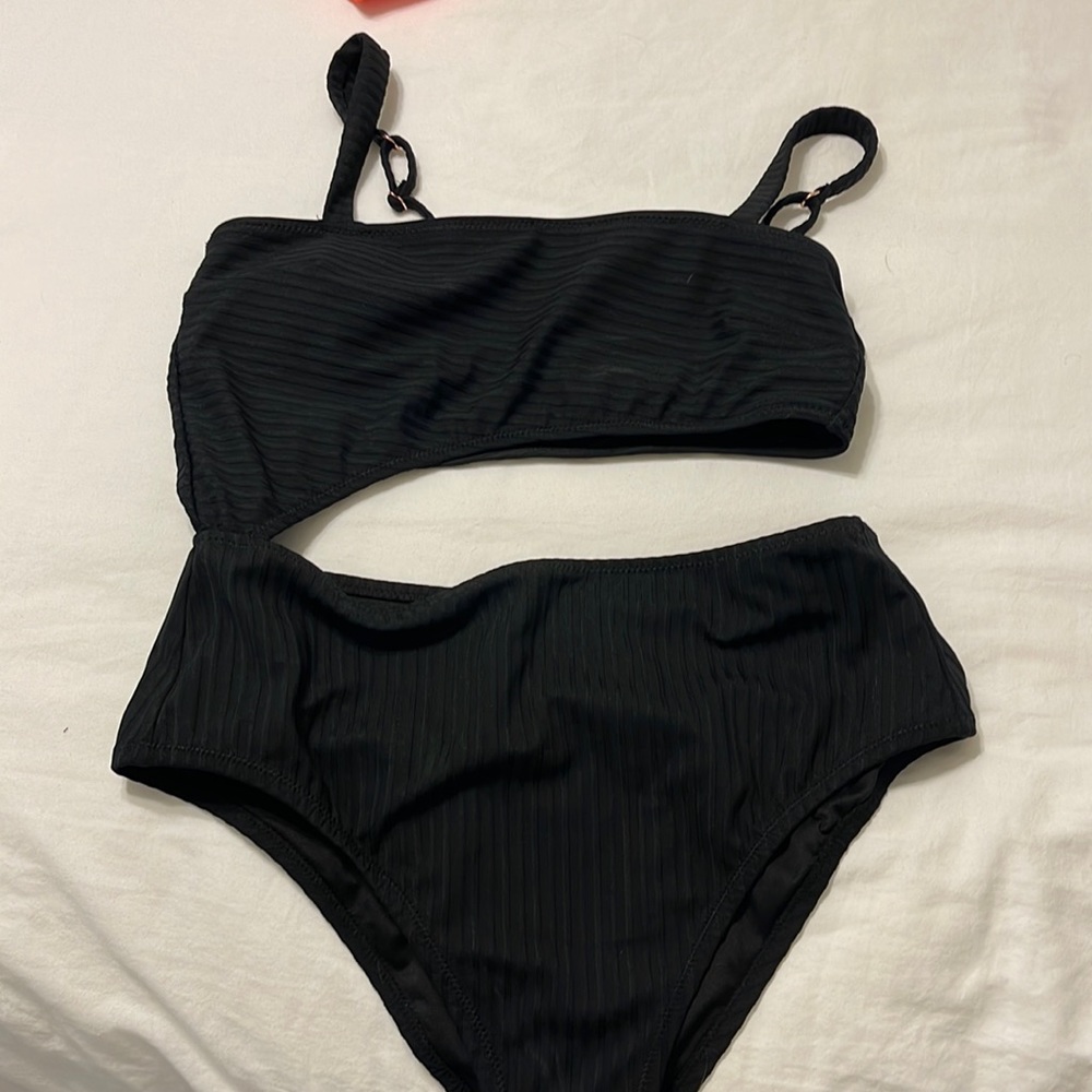 One piece with cutout- never worn.